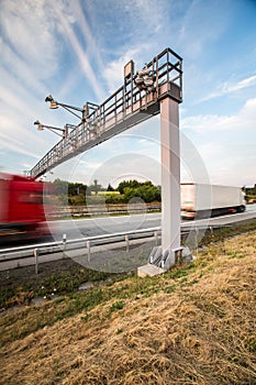 Truck passing through a toll gate on a highway