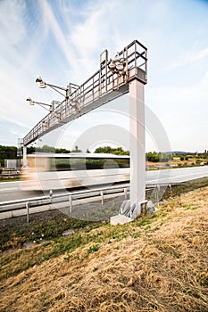 Truck passing through a toll gate on a highway