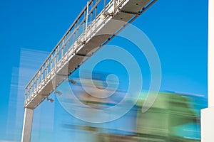 Truck passing through a toll gate on a highway toll roads