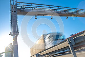 Truck passing through a toll gate on a highway toll roads