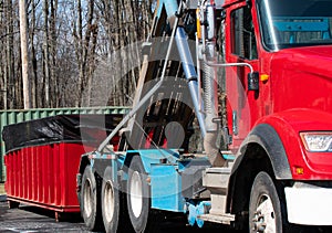 truck picking up the container garbage auto dump