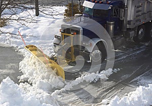 Truck Plowing Snow on Street