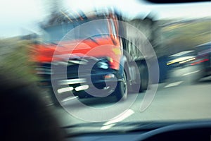 Truck with red cab on the road in motion. Accident rate