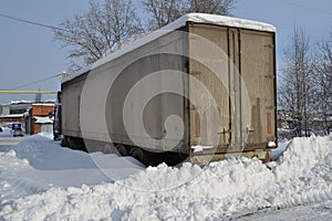 Truck. Refractor. Littered with snow. Snow drifts, unpeeled roads. Impassable snow drifts