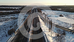 truck rides on the road in winter. aerial 4k drone footage