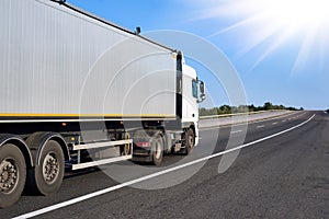 Truck on road with clear container, cargo transportation concept