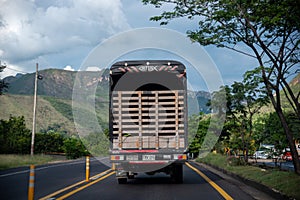 Truck on a rural road in a mountainous area of Colombia.