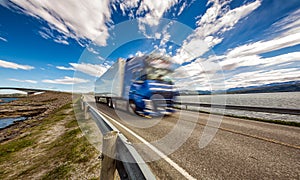 Truck rushes down the highway in the background Atlantic Ocean R