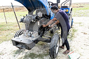 Truck Service Oil Level Check. Tractor maintenance and repair of tractor. Close up view of hydraulic pipes of heavy industry