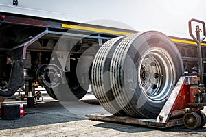 Truck Spare Wheels Tires Waiting for to Change. Freight Trucks Transport. Workshop Auto Service