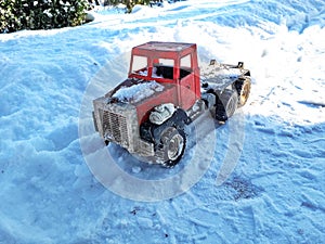 The truck is stuck in a snow trap