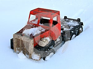 The truck is stuck in a snow trap.Transport in winter on a snow road