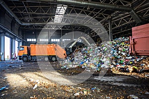 Truck throws garbage at sorting modern waste recycling processing plant. Separate and sorting garbage collection. Recycling and