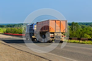 Truck with a Trailer Carries Goods