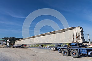 Truck transport pre-fabricated concrete beam to construct light rail transit infrastructure