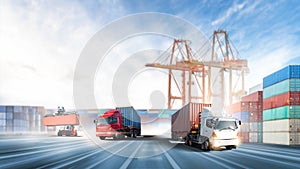 Truck transport red and blue container on highway with container handler in the loading at port cargo shipping dock