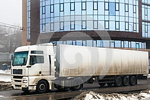 Truck transportation on city road at urban background
