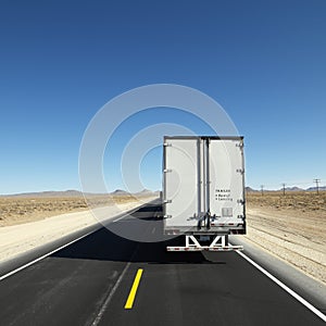 Truck traveling down highway.