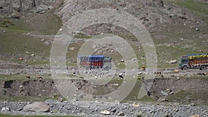 A truck is traveling on a mountain road in Kashmir