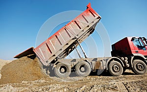 Truck unloading sand