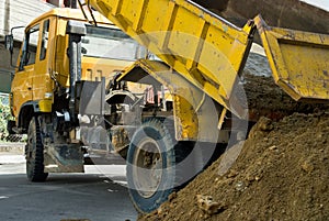 Truck unloading sand