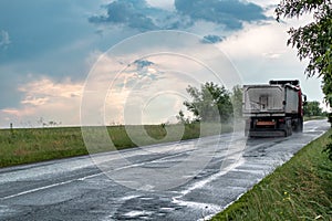 Truck vehicle driving wet road in rainy weather