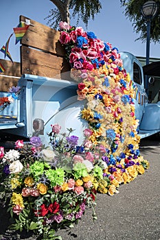 A truck with a vibrant display of colorful flowers