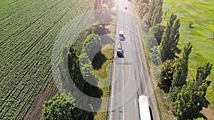 Truck, wagon and car driving on the highway, aerial. Transport logistics background