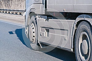 Truck wheels on road in motion