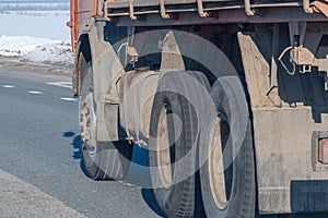 Truck wheels on road in motion