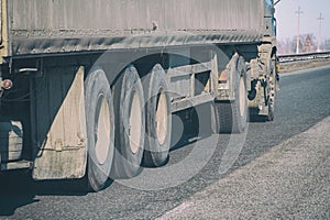 Truck wheels on road in motion