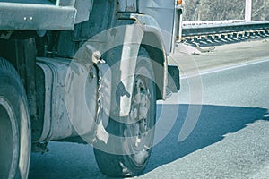 Truck wheels on road in motion