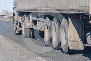 Truck wheels on road in motion