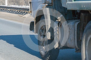 Truck wheels on road in motion