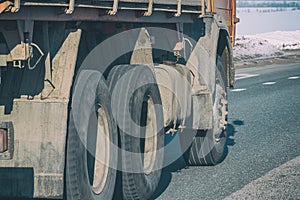 Truck wheels on road in motion