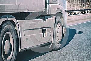 Truck wheels on road in motion