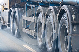 Truck wheels on road in motion