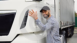 Trucker hugging his truck vehicle for transportation. Happy truck driver loving his job