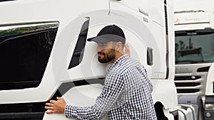 Trucker hugging his truck vehicle for transportation. Happy truck driver loving his job