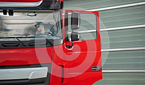 Trucker Inside His Truck Cabin Preparing For a Route