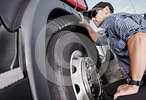 Trucker Making Tire Check