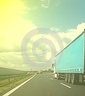 Trucks carrying motorway loads.  concept of heavy transport, international transport and courier parcel