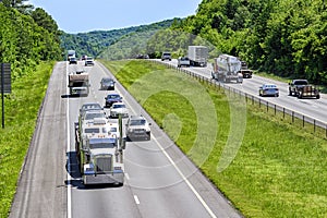 Trucks, cars and SUVs roll down an interstate highway in eastern Tennessee