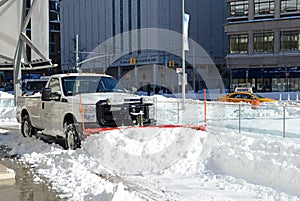 Trucks cleaning snow from streets after blizzard