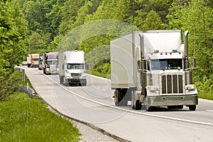 Trucks driving on divided roadway