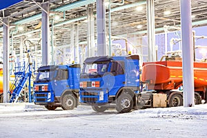 Trucks at gas station on oil refinery factory