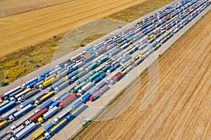 Trucks in line at the loading terminal. Transportation of goods by cars