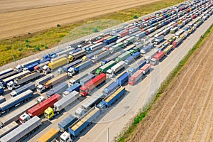 Trucks in line at the loading terminal. Transportation of goods by cars