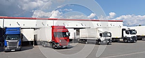 Trucks loading at a depot of a forwarding agency - Transport and logistics in goods trade