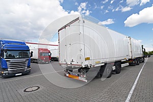 Trucks loading at a depot of a forwarding agency - Transport and logistics in goods trade